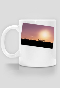 Kubek z zachodem słońca od caffee